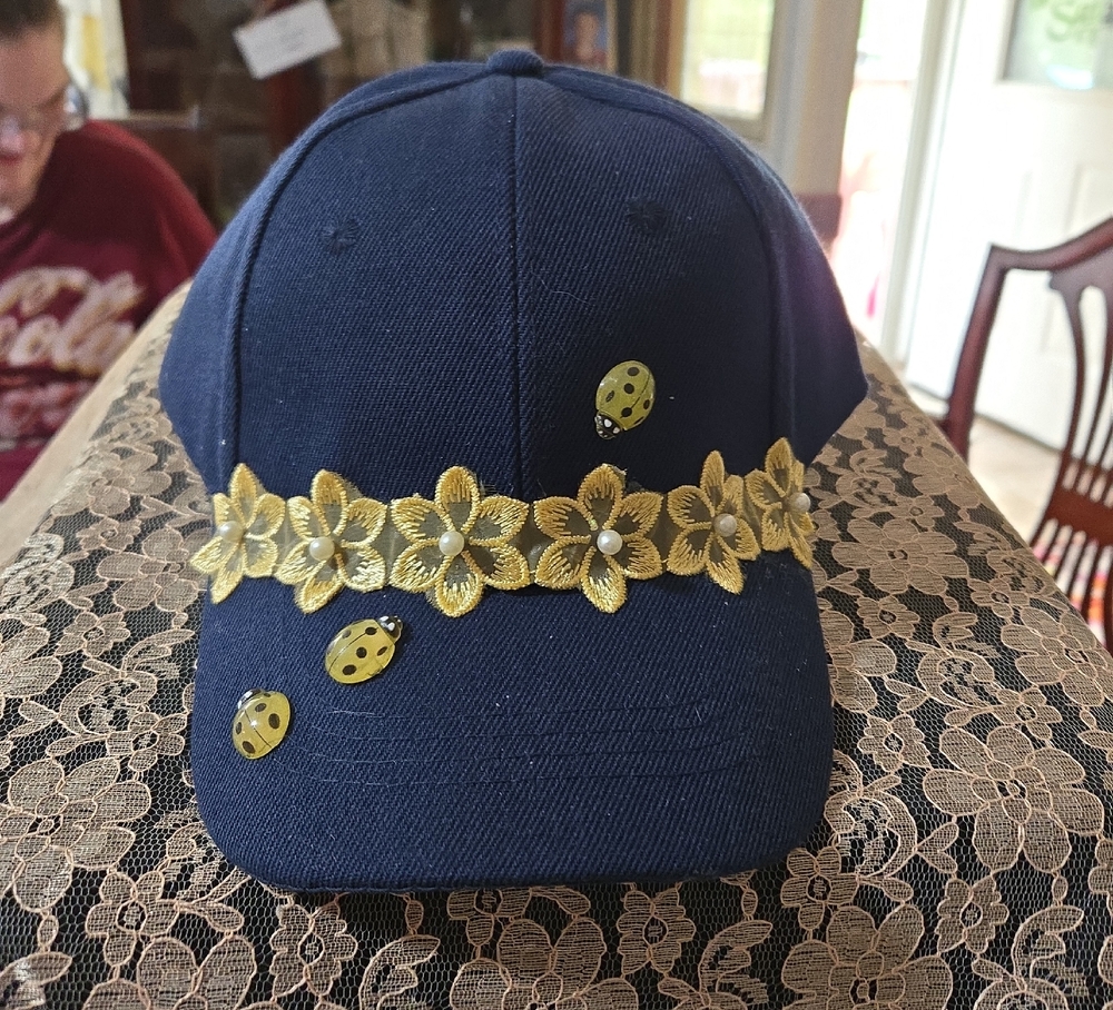 Navy Blue Cap with Yellow Floral and Ladybug Design
